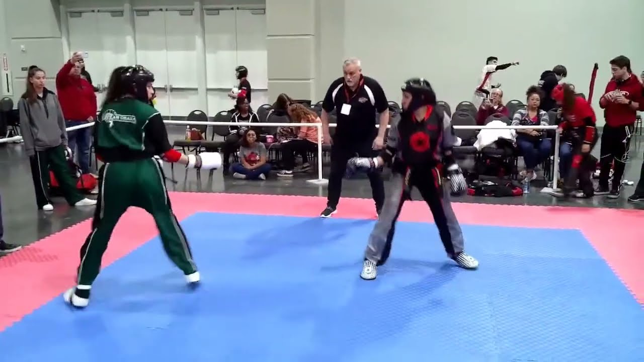 Female Black Belt Sparring at Compete World Martial Arts Tournament