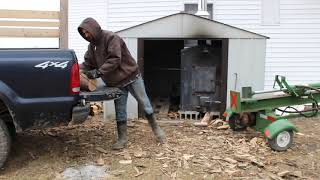 splitting and stacking firewood on the homestead