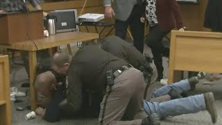 ⁣Father of victims lunges at Larry Nassar in court