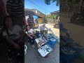 Amerikano selling fish in the market