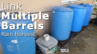 Link multiple 55 gallon closed top barrels to collect rain water