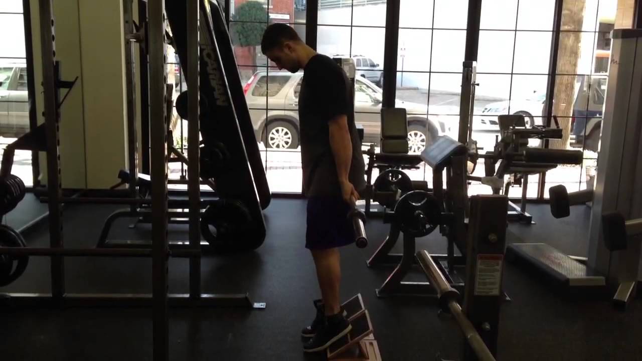 Muscle How To Hack Squat Heel Elevated w/Barbell YouTube