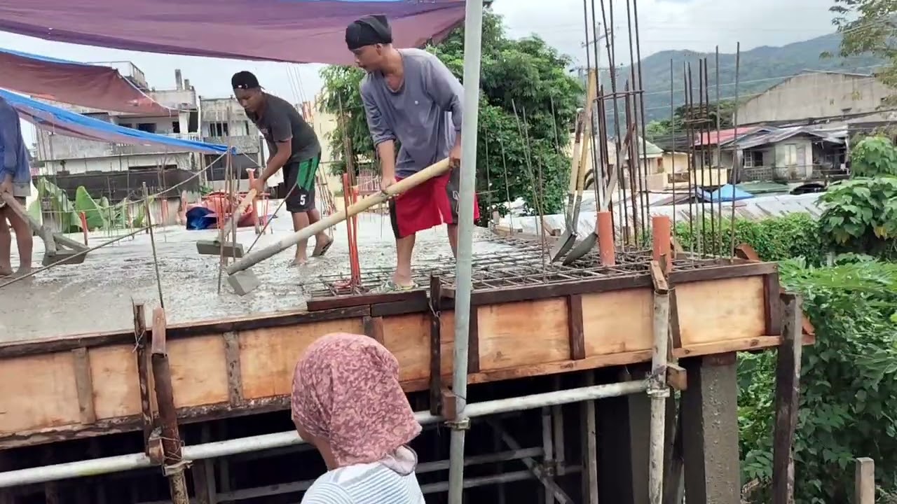 Excavator and transit mixer at work
