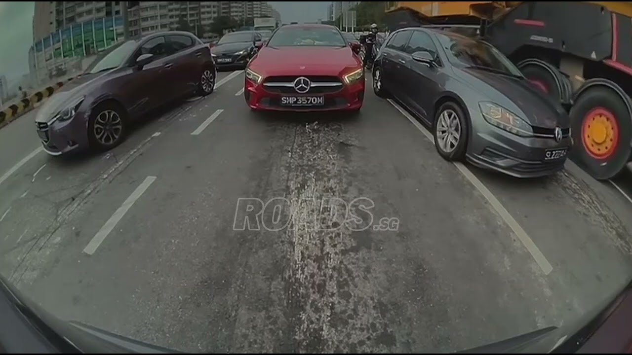 A vehicle in a heavy vehicle’s blind spot was hit and dragged, causing a multi-vehicle collision.