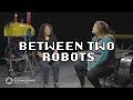 Mia and Kaitlyn: Between Two Robots