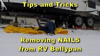 Removing nails from RV Bellypan for access to run wires for the RV Electrical System Upgrade Project