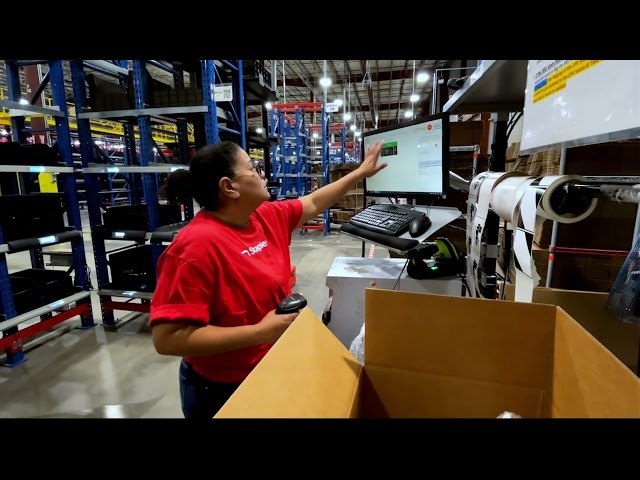 Staples Supply Chain - Employees Work With Robots