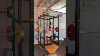 Heels elevated high bar narrow stance squat