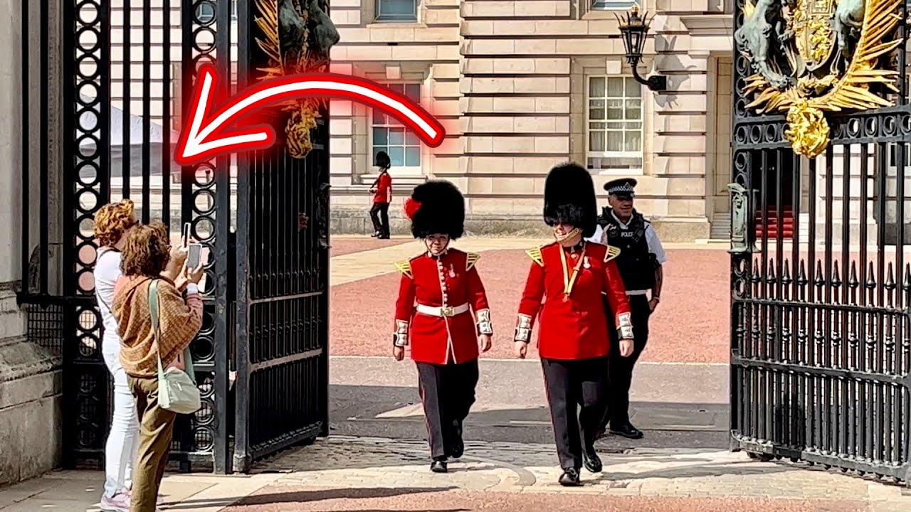 Tourists photograph LAUGHING FEMALE Guards leaving Buckingham Palace