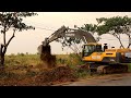 Excavator Volvo EC300dl clearing roadside