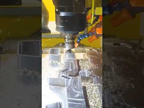Automated milling of steel parts with the FANUC ROBODRILL Plus #shorts #automation #machinetools