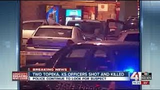 Two Topeka policemen shot near store