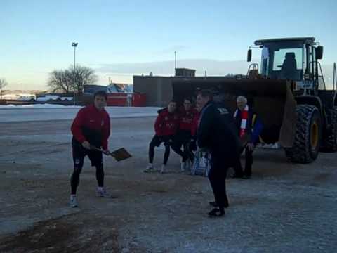 www.eveningexpress.co.uk Dons manager Mark McGhee accidently throws sand in the face of EE reporter Sean Wallace while spreading grit around Pittodrie in the snow and ice.