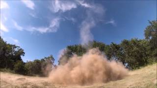 2.5 pounds of exploding target under a plastic drum.