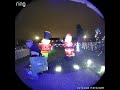 Woman Topples While Adjusting Christmas Inflatables