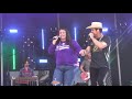 Dustin Lynch performing "Thinking 'Bout You" with binging a fan named Kayla on stage!