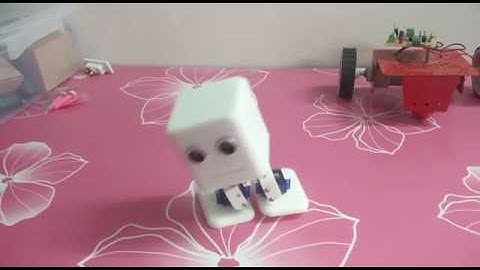 Mini biped Robot with Obstacle sensor based on Arduino