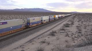 EBD BNSF stack train with Canadien National pool power  in desert @ Essex CA 3/17/22