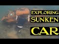 Exploring sunken car at the bottom of a lake