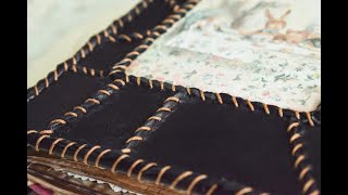 Leather patchwork. Handmade textured book cover with visible stitches.
