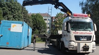 MAN TGS with Palfinger PK 85002 crane lifting & loading containers