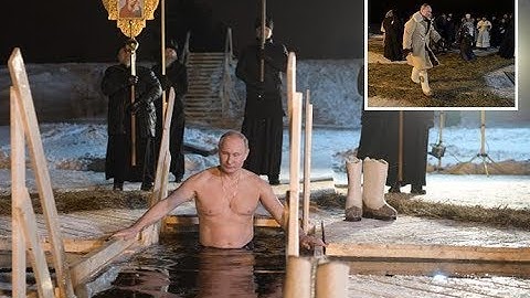 Vladimir Putin braves subzero temperatures in icy dip to mark ultra religious Christian