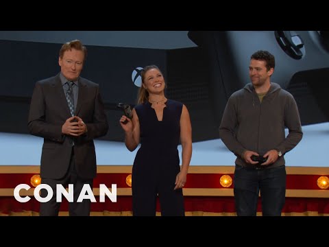 Ronda Rousey Demonstrates The True Power Of The Xbox One X Console  - CONAN on TBS