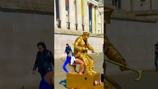 Man in Gold sitting on contortionist lady #marriageproposals #statue #busking #viral