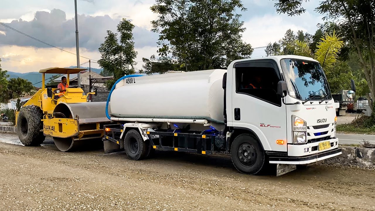 Water Truck & SAKAI Soil Compactor Working in Public to Compact the Road in Construction - Takengon