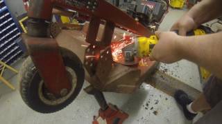 Welding a patch on the deck of the Toro Proline