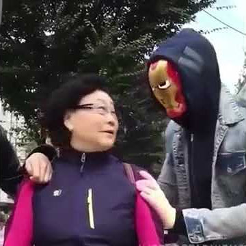 Asian woman more scared when he takes off the mask