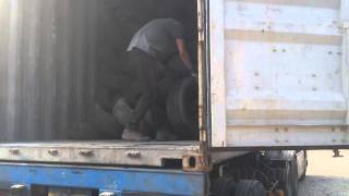 Used tyres loading to container for Haiti