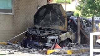 Bank employees report hearing small explosion before smoking car erupts in flames in drive thru