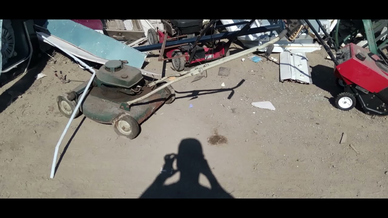 Vintage 1950 Wards Garden Mark mower with Clinton engine in scrap pile