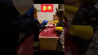 Picking up mini marshmallows using cups.