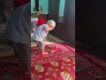 Cute child is performing namaz