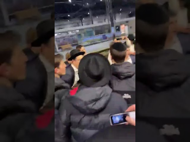 Boys in Gateshead singing at the train station