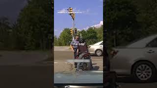 Biker Pushes Cop Into Oncoming Traffic