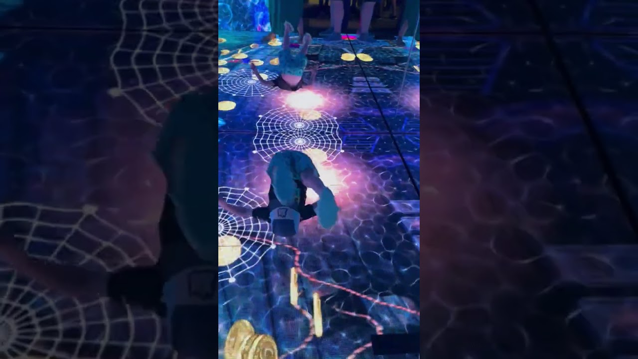 Boy wearing baseball hat runs into wall at mirror maze while chasing fish on floor