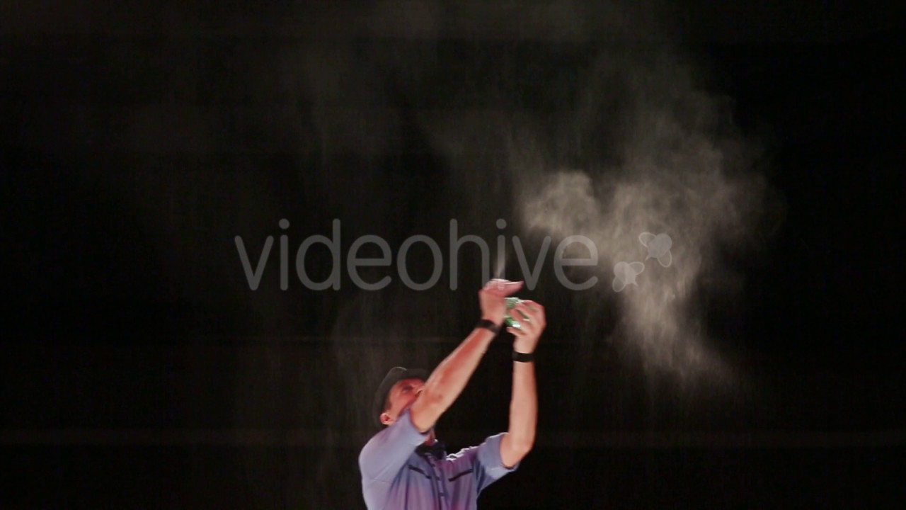 The man the actor sprays water for air moistening. Soap bubbles show