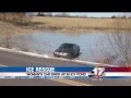 Woman safe after driving off the road and onto icy pond