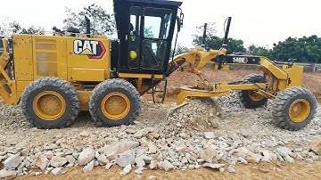 Brand new Caterpillar Grader 140 Spreading and mixing Crush rock material at the site.