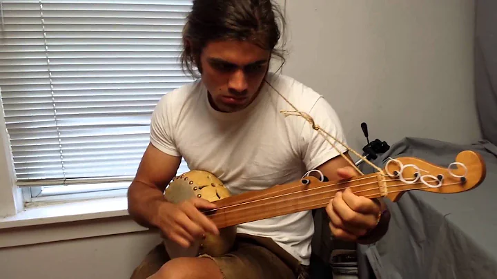 John Vocke showing off his new gourd banjo.