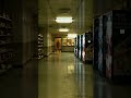Watch the lights flicker behind the locked doors | a closed gas station convenience store at night,