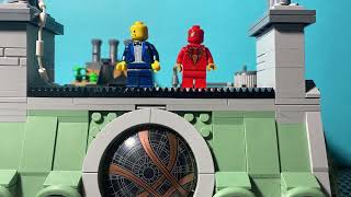 Spider man pushes Lego man off the sanctum!