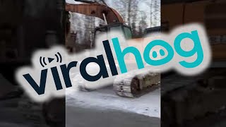 Sliding a Backhoe Down an Icy Road || ViralHog