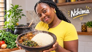 A Ghanaian learning how to cook Nshima, Zambia's national dish in Zambia 