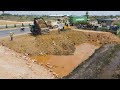 The globe is incredible a group of trucks bulldozer are preparing to unloading soil into the lot