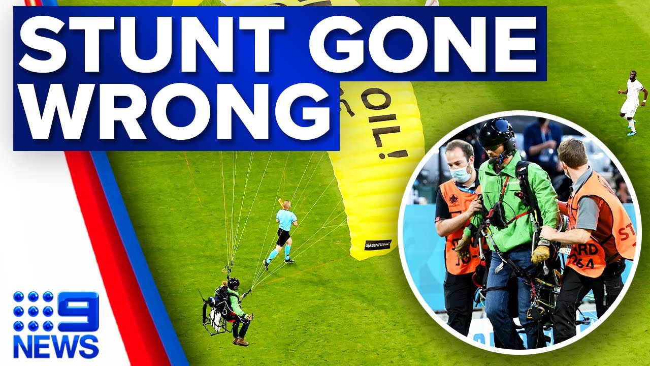 Greenpeace apologises after protester parachutes into German stadium | 9 News Australia