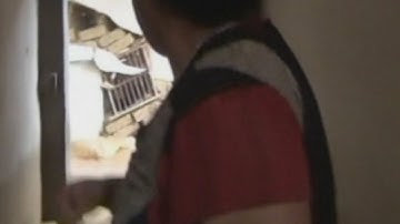 The terrifying moment a house collapses during floods in China is caught on camera